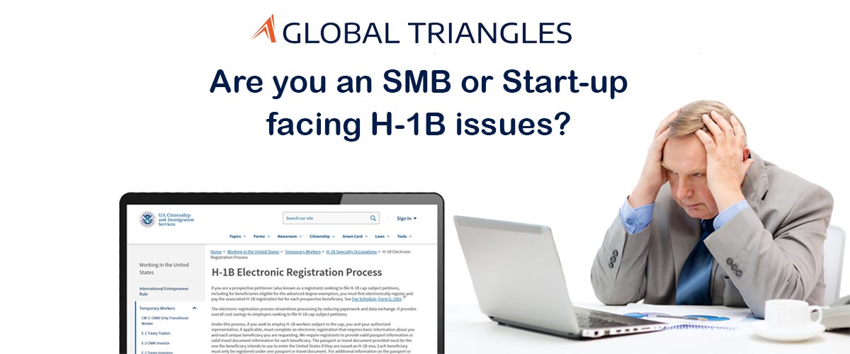 Man from a start-up holding his head in his hands looking at an H-1B Visa application